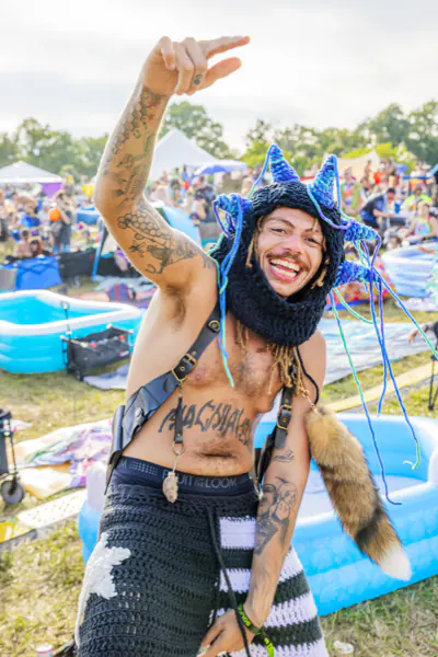 Smiling attendee in a crocheted cat hood at Sound Haven 2026