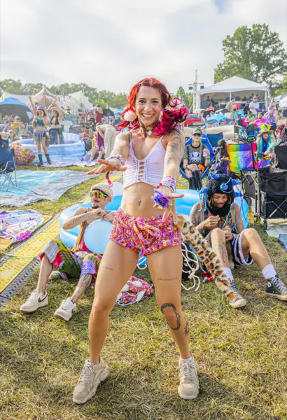 Festivalgoer dancing beside inflatable pools at the Sound Haven 2026 campground
