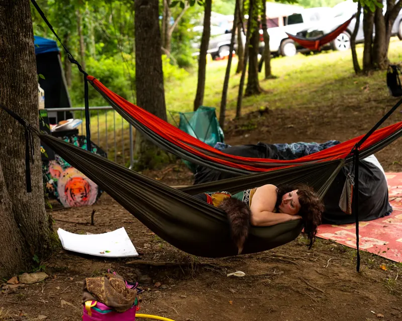 Hammocks strung between the trees at the Sound Haven 2026 campground